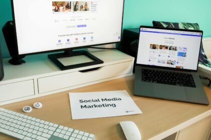 Stylish workspace with laptop and monitor for social media marketing.